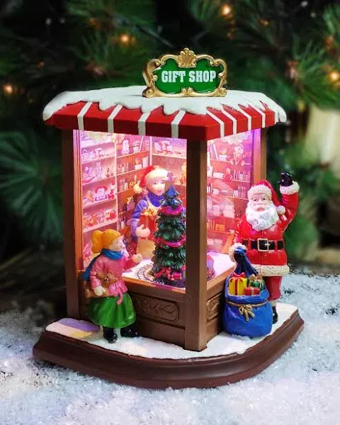 MOMENTS IN TIME 8.86”H Vintage Corner Gift Shop - LED Lights, 8 Classic Carols Christmas Music, Battery Operated Christmas Village - Hand-Painted Resin Polyresin