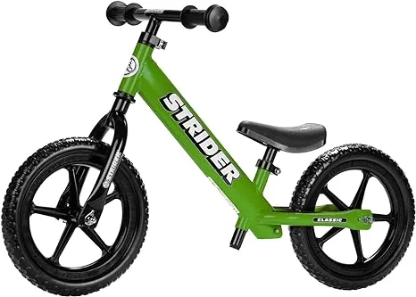 Strider 12” Classic Bike - No Pedal Balance Bicycle for Kids 18 Months to 3 Years - Includes Built-In Footrest, Handlebar Grips & Flat-Free Tires