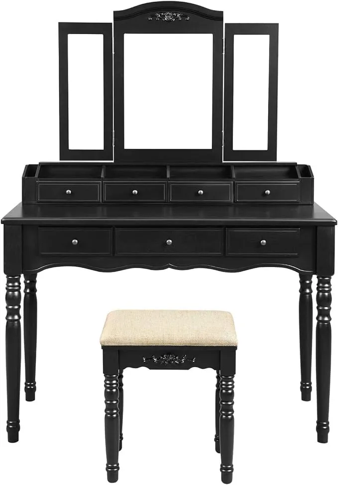 VASAGLE Vanity Makeup Set with 7 Drawers, 2 Brush Slots and 4 Open Compartments, Dressing Table with Tri-Fold Necklace Hooked Mirror, Solid Wood Legs, Cushioned Stool, Black URDT06BK